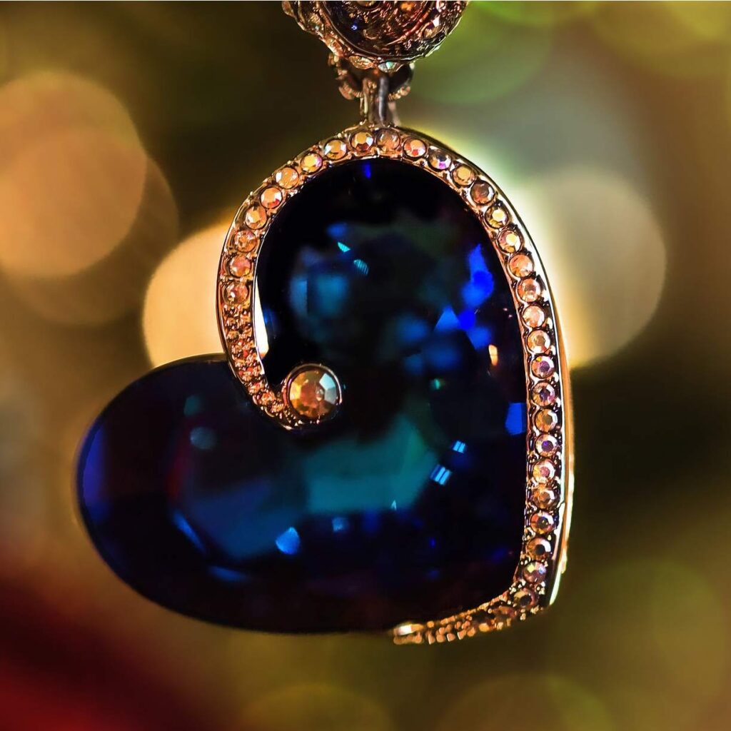 Handmade sapphire gold love heart pendant.